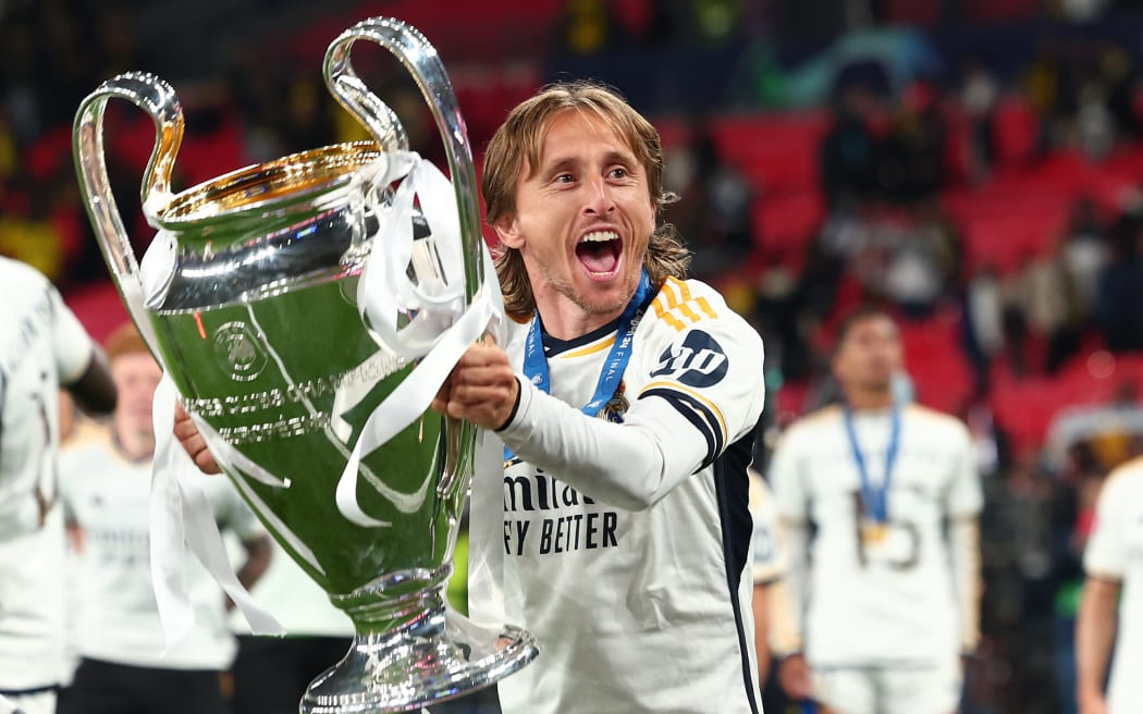 Luka Modric of Real Madrid celebrates with the UEFA Champions League Trophy
