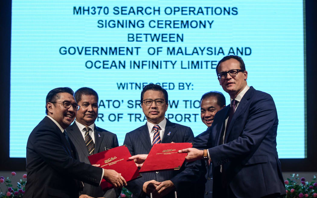 The MH370 search signing.