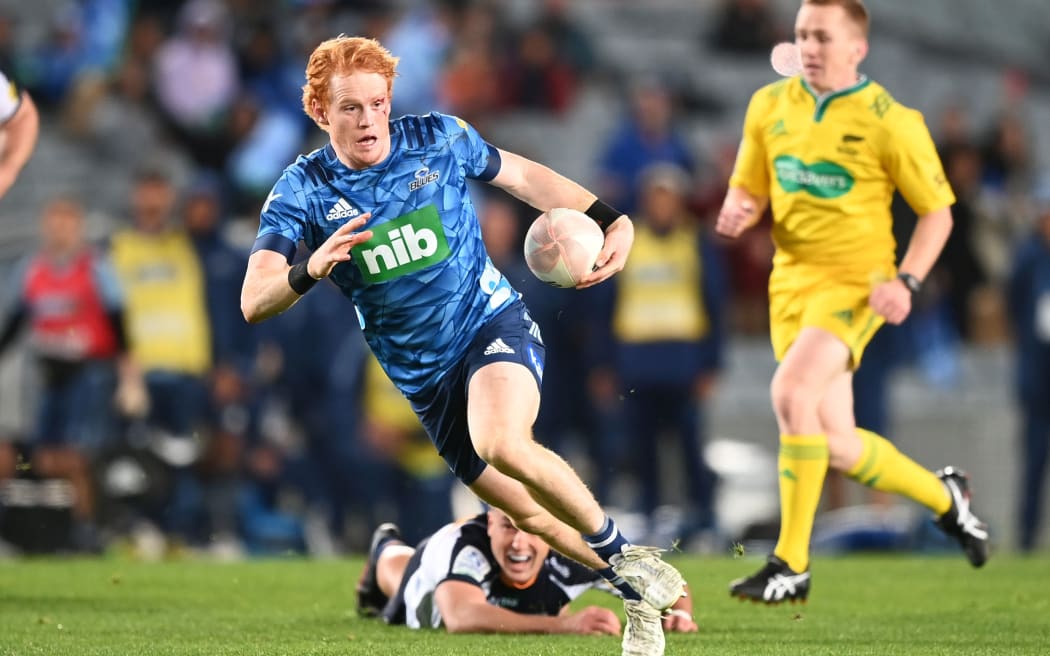 Blues halfback Finlay Christie on his way to the try line.