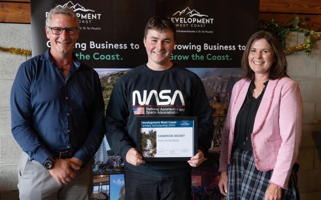Development West Coast chief executive Heath Milne (left) scholarship recipient Cameron Dickey and Development West Coast chair Renee Rooney.