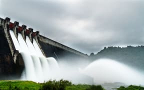 dam spilling water