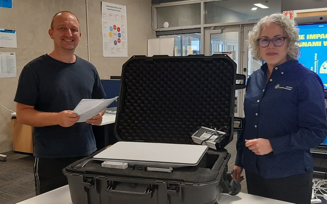 Technician Jason Somerville and Claire Brown with one of the Starlink kits now deployed around the Coast.