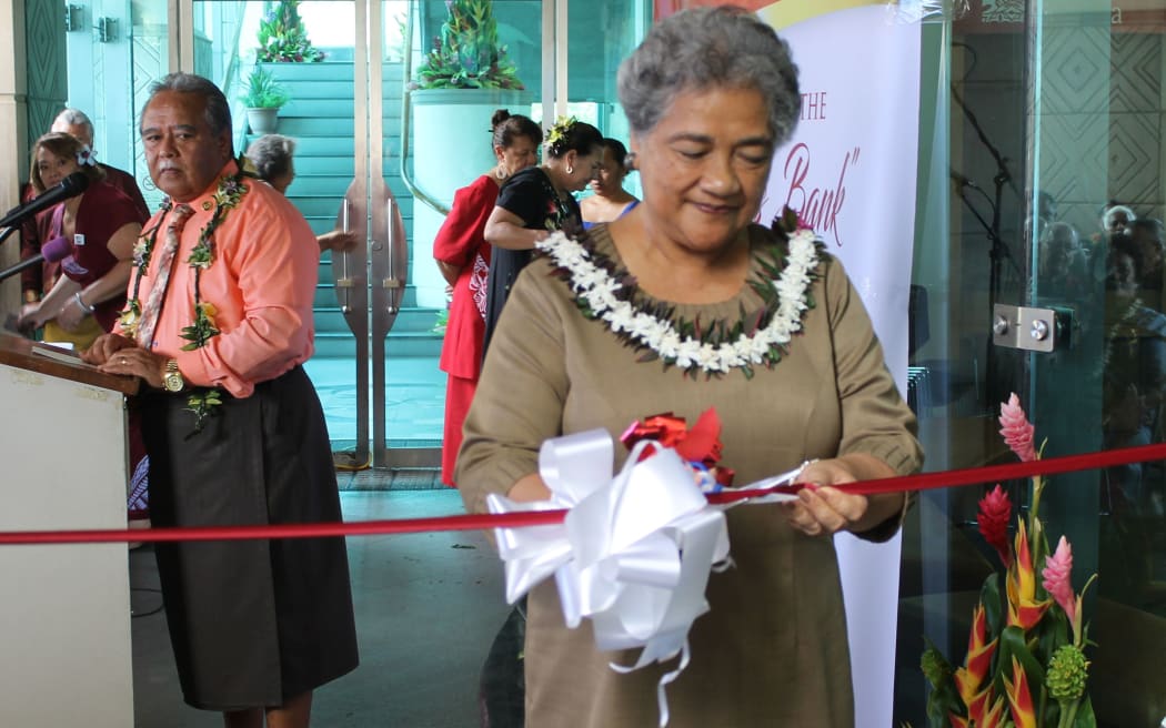First Lady Cynthia Moliga officially opens the new government bank as others watch on