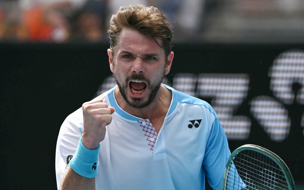 Switzerland’s Stan Wawrinka reacts after a point against Serbia’s Laslo Djere during their men's singles match on day two of the Australian Open tennis tournament in Melbourne on January 19, 2026. (Photo by WILLIAM WEST / AFP) / -- IMAGE RESTRICTED TO EDITORIAL USE - STRICTLY NO COMMERCIAL USE --