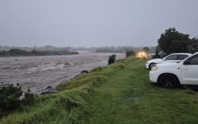 Waiwakaiho river in New Plymouth is filled with trees and debris.