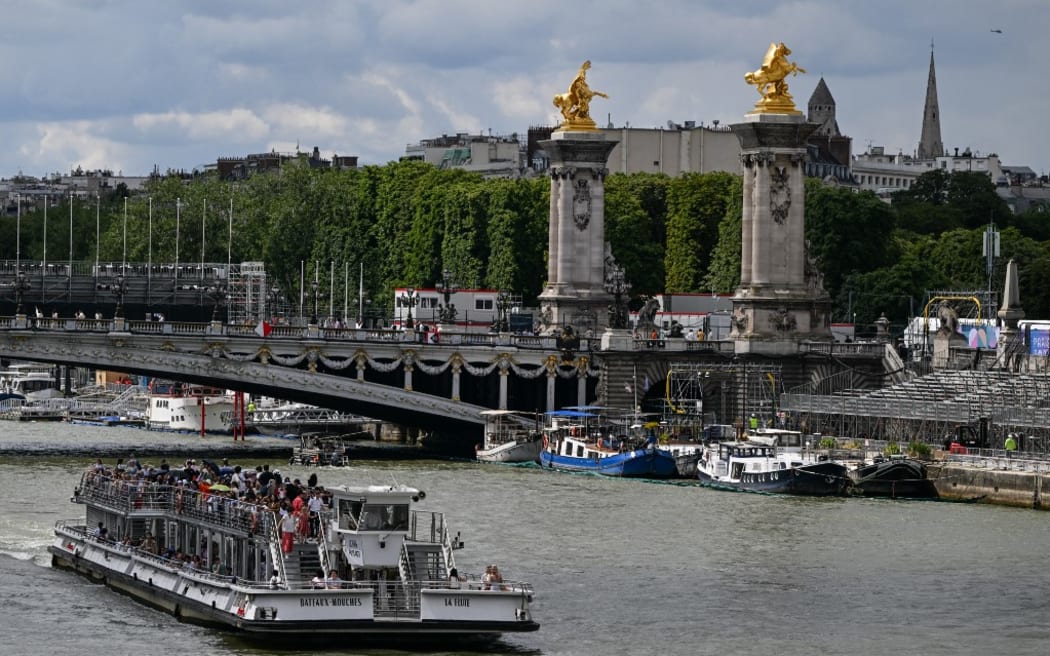 PARIS, FRANCE - JULY 13:   
One of many Bateaux Mouches seen on the Seine River, on July 13, 2024, in Paris, France. (Photo by Artur Widak/NurPhoto) (Photo by Artur Widak / NurPhoto / NurPhoto via AFP)