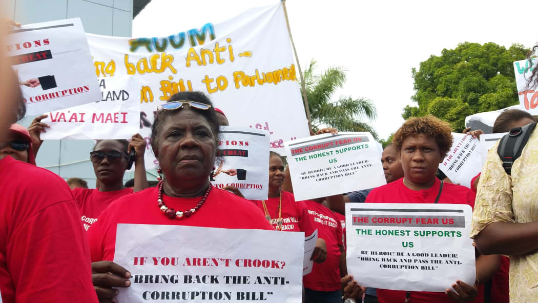Protestors in Solomon Islands hold up placards during a march to petition government to bring back its proposed anti-corruption laws. September 2017