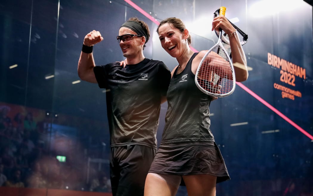 Joelle King and Paul Coll of New Zealand celebrate winning the Mixed Doubles Gold Medal Match at the University of Birmingham Hockey and Squash Centre.