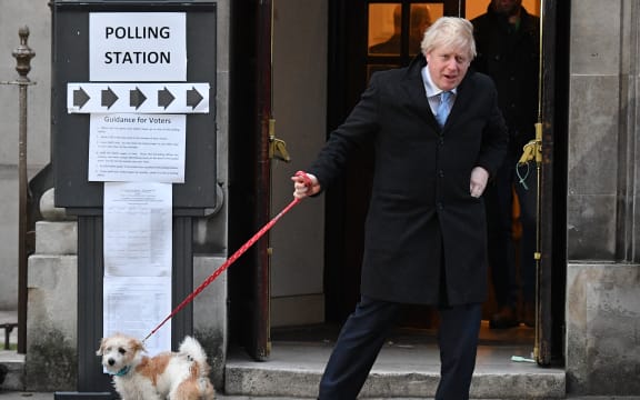 Boris Johnson - with his dog Dilyn  - leaves a polling station voting.