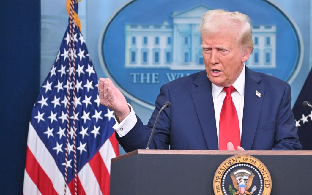 US President Donald Trump speaks about the mid-air crash between American Airlines flight 5342 and a military helicopter in Washington, in the Brady Press Briefing Room at the White House on January 30, 2025 in Washington, DC. Divers pulled bodies from the icy waters of Washington's Potomac river Thursday after a US military helicopter collided midair with a passenger plane carrying 64 people, with officials saying there were likely no survivors.