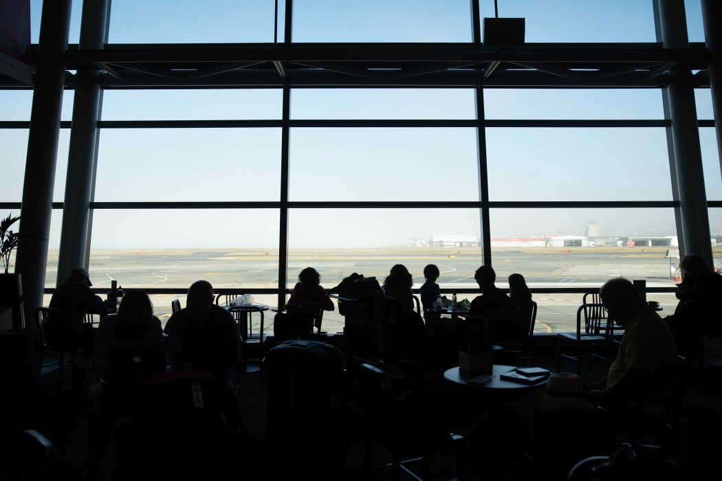 Low fog delays and cancels flights at Wellington Airport Tues 21st Jan 2020.  View of fog through Wellington Aiport windows.