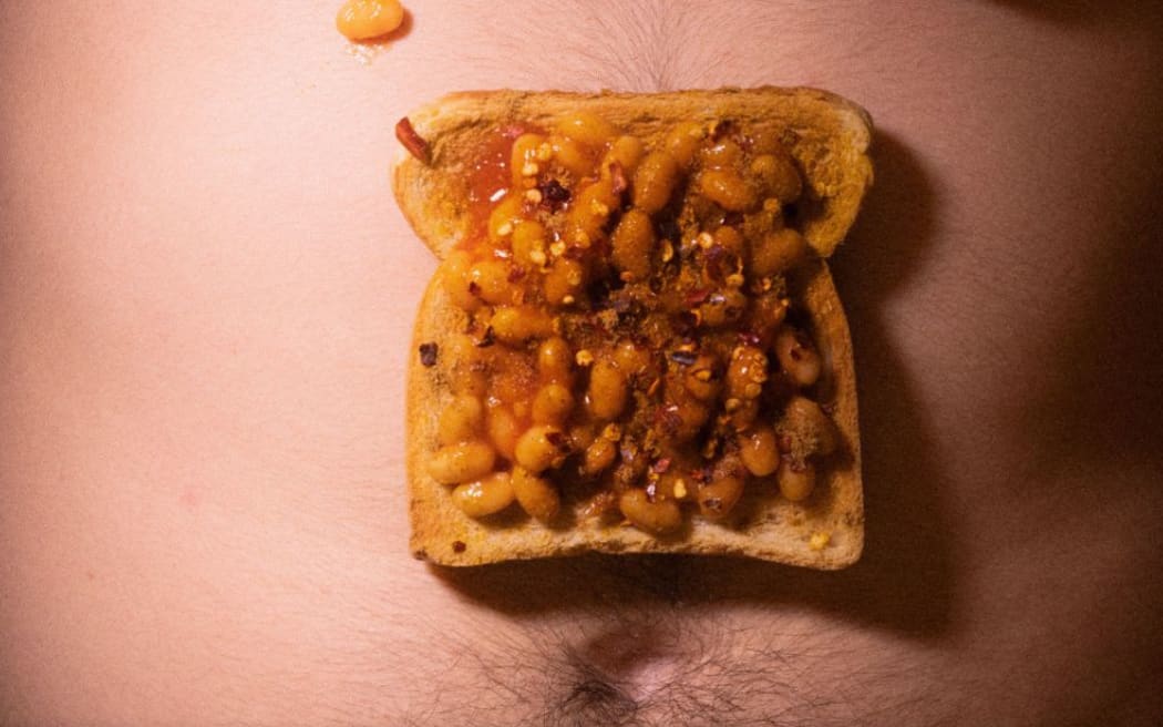 baked beans on a hairy stomach