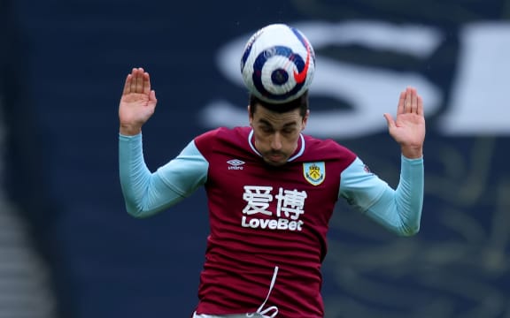 Matthew Lowton of Burnley heads the ball