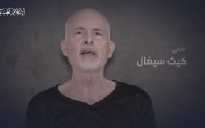 An image grab from a video released by the media office of the Palestinian militant group Hamas on April 27, 2024, shows a man who identified himself as Keith Siegel, one of the hostages abducted during the Hamas attack on October 7, 2023, speaking to a camera. The armed wing of Palestinian militant group Hamas released video on Saturday of two men held hostage in Gaza and seen alive in the footage. The latest video comes just three days after Hamas released another video showing hostage Hersh Goldberg-Polin alive. (Photo by AFP) / RESTRICTED TO EDITORIAL USE - MANDATORY CREDIT "AFP PHOTO / HAMAS MEDIA OFFICE" - NO MARKETING NO ADVERTISING CAMPAIGNS - DISTRIBUTED AS A SERVICE TO CLIENTS / ATTN CLIENTS: VIDEO FILMED UNDER DURESS.  FAMILY HAS GIVEN PERMISSION FOR THE VIDEO TO BE USED BY THE MEDIA, THE HOSTAGES FAMILIES FORUM CAMPAIGN GROUP SAID IN A STATEMENT / ON-SCREEN SUBTITLES, EFFECTS FROM SOURCE.