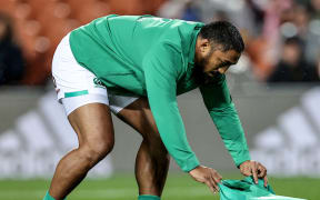 2022 Summer Tour, FMG Stadium, Hamilton, New Zealand 29/6/2022 Māori All Blacks vs Ireland 
Ireland's Bundee Aki presents the Māori All Blacks with a jersey after the recent passing of Waikato rugby player Sean Wainui