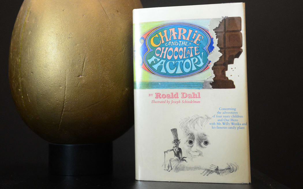 The first edition book 'Charlie and the Chocolate Factory' and the original hero Golden Egg from the film "Willy Wonka and the Chocolate Factory" on display at Profiles In History in Calabasas, northwest of downtown Los Angeles, on July 19, 2012 in California, ahead of a public auction which begins on July 28. Auction house Profiles in History, the world's largest auctioneer and dealer of original Hollywood memorabila, will handle the sale of the celebrated Drier Collection, which due to its size, scope and significance, will take nearly two years and several auctions for all of the material to be offered. The book, first published in 1964 comes with a signed letter from Roald Dahl and is estimated between $3,000 - $5,000 while the Egg, which measures approximately 12 inches long, made of polystyrene foam and painted gold, is estimated between $20,000 - $30,000. AFP PHOTO/Frederic J....