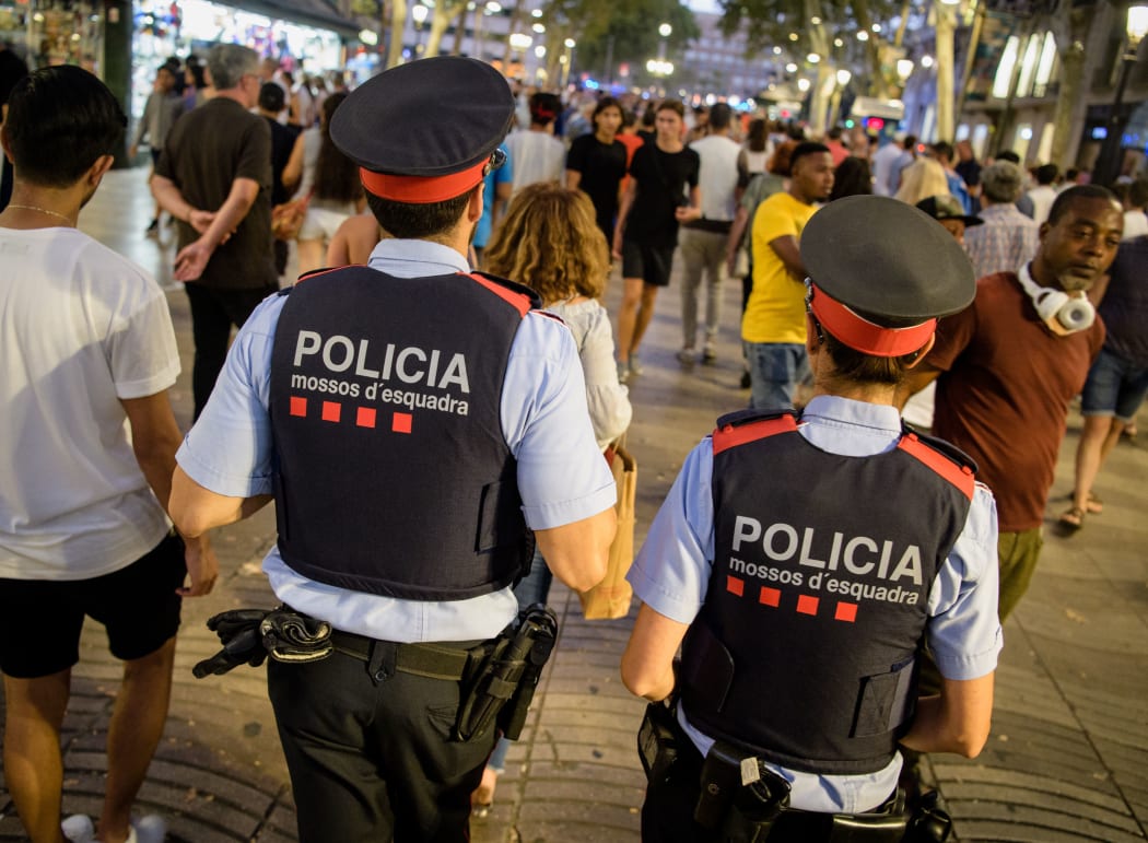 Police patrol Barcelona's Las Ramblas over the weekend following a terrorist attack that killed 13 people.