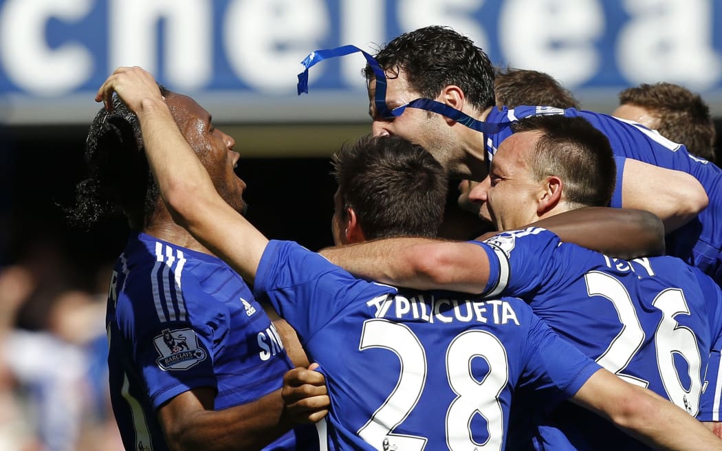 (L-R) Chelsea's Ivorian striker Didier Drogba, Cesar Azpilicueta, John Terry,  Cesc Fabregas during the English Premier League football match between Chelsea and Crystal Palace at Stamford Bridge in London on May 3, 2015.