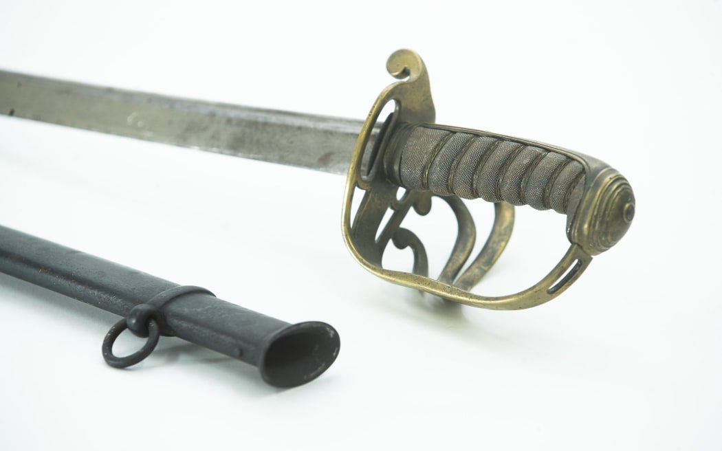 A sword and scabbard owned by Captain Arthur Algernon Crapp.