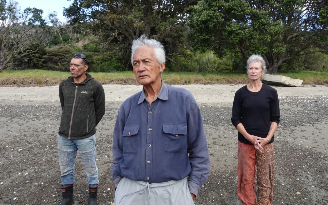 Kaumātua Matutaera Clendon, centre, with nephew John Clendon and partner Bronna Brown on the shore at Otupoho/Homestead Bay.