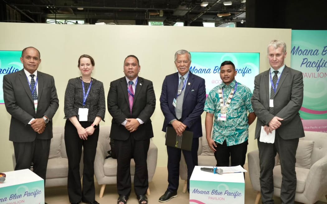 Speaking to island representatives in Dubai Saturday night, Henry Puna, third from right, said his message was "let's not lose hope".