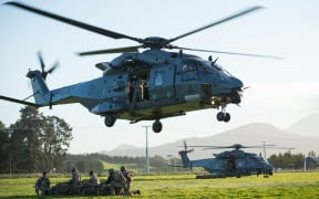 Two NH90 helicopters of the Royal New Zealand Air Force touch down and release New Zealand Army soldiers to secure an area in the town of Ward, as part of exercise Southern Katipo.