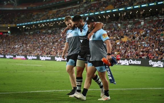 Shaun Johnson limps off injured.