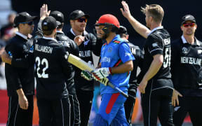 The Black Caps celebrate the wicket of Rahmat Shah in their World Cup pool match in Taunton.