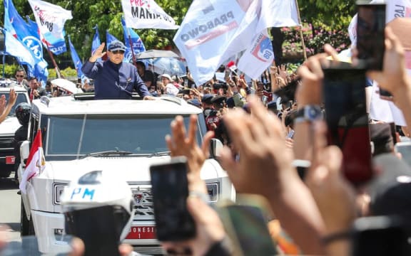 President Prabowo Subianto greets people as he rides in a car after his inauguration in Jakarta, Indonesia, Oct. 20, 2024, [Asprilla Dwi Adha/Antara Foto]