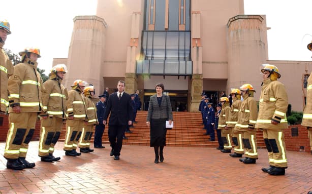 WELLINGTON, NEW ZEALAND - SEPTEMBER 11: Prime Minister of New Zealand walks through a guard of honour from Policemen and Firemen outside Wellington Cathedral of St Paul where a service of remembrance was held for those who suffered and died during the terrorist attacks on September 11 in New York, Pennsylvania and at the Pentagon one year ago. (Photo by Robert Patterson/Getty Images)