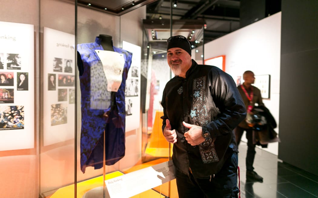 Ryan Monga with his blue suit at Auckland Museum's Volume exhibition.