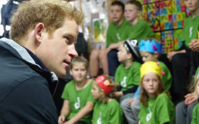 Prince Harry with children at Halfmoon Bay School.