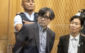 21st October  2024 Iain McGregor/The Press
Tingjun Cao in Christchurch High Court facing trial for the murder of Yanfei Bao. Pictured in the dock with an interpreter.