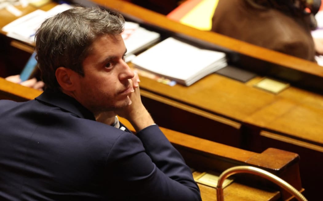 President of Ensemble Pour la Republique parliamentary group Gabriel Attal attends a parliamentary debate on the legislative process for a social media ban on under-15s at the Assemblee Nationale, France's lower house Parliament in Paris on January 26, 2026. French lawmakers are set to vote on draft legislation to ban social media for under-15s, an effort championed by President Emmanuel Macron as a way to protect children from excessive screen time. The legislation, which also provides for a ban on mobile phones in high schools, follows Australia banning social media for under-16s in December, a world first. As social media has grown around the world, so has concern that too much screen time is arresting child development and contributing to declining mental health in minors. (Photo by Ludovic MARIN / AFP)