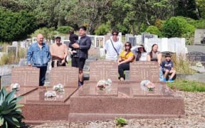 The Karatea-Goddard family paying respects to their Kwok ancestors at Karori Cemetery, Wellington, on Lunar New Year.