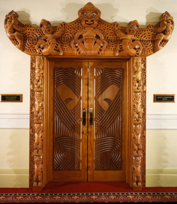 The carved and linteled door to the Maori Select Committee Room