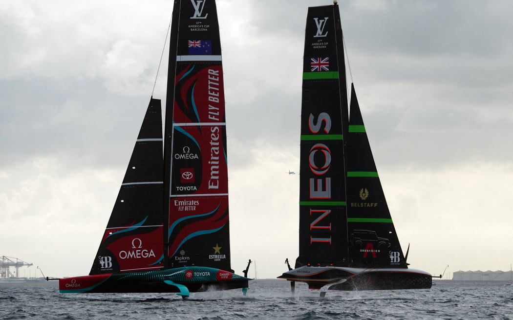 Britain's Ineos Britannia (R) and defender Emirates Team New Zealand compete on day 1 of the Louis Vuitton 37th America's Cup Match, off the coast of Barcelona on October 12, 2024. (Photo by Manaure Quintero / AFP)