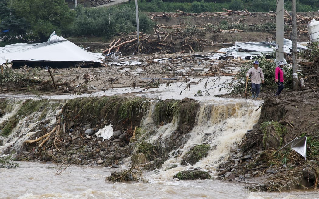 A scene of destruction in Yecheon, South Korea. At least 37 people have died in total after flooding, landslides and power cuts across much of the country and thousands more have had to evacuate their homes due to rain damage.
