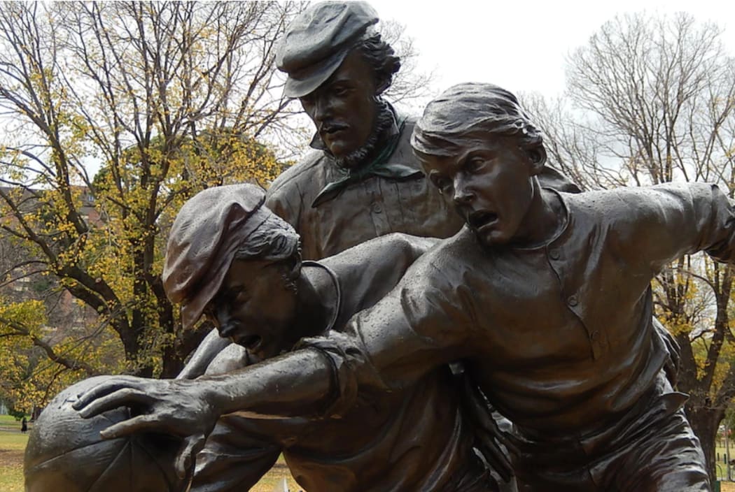A bronze statue outside the MCG depicts Wills (middle) umpiring one of the earliest games of Australian Rules football in 1858.