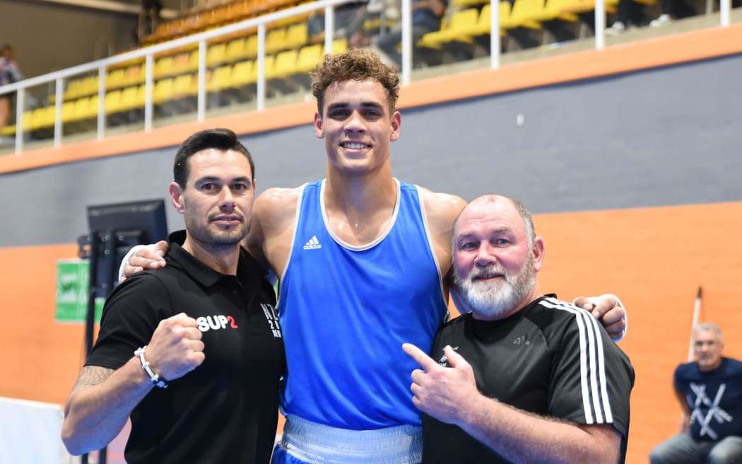 David Nyika with New Zealand coaches Thomas Rangiawha and Billy Meehan.