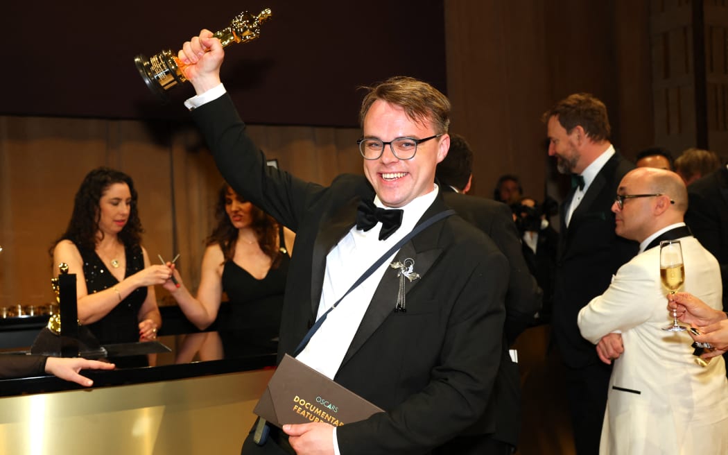 Russian teacher Pavel Talankin hoists his Oscar for Best Documentary Feature Film for "Mr. Nobody Against Putin" at the 98th Annual Academy Awards Governors Ball at the Dolby Theatre in Hollywood, California on March 15, 2026.
