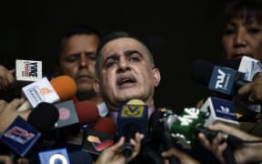 Venezuelan Prosecutor Tarek William Saab, delivers a statement at the Supreme Court of Justice in Caracas to announce he has asked the Supreme Court to bar Venezuela's self-proclaimed "acting president" Juan Guaido, from leaving Venezuela and to freeze his assets.