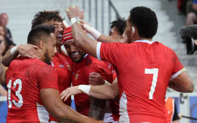 Tonga's wing Kyren Taumoefolau (2nd L) celebrates with teammates after scoring a try during the France 2023 Rugby World Cup Pool B match between Tonga and Romania at the Stade Pierre-Mauroy in Villeneuve-d'Ascq, near Lille, northern France on 8 October, 2023.