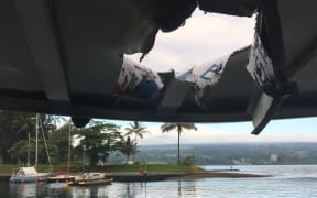 Rocks and debris in flying lava from the Kilauea volcano punched a hole through the roof of a tourist boat and injured passengers,