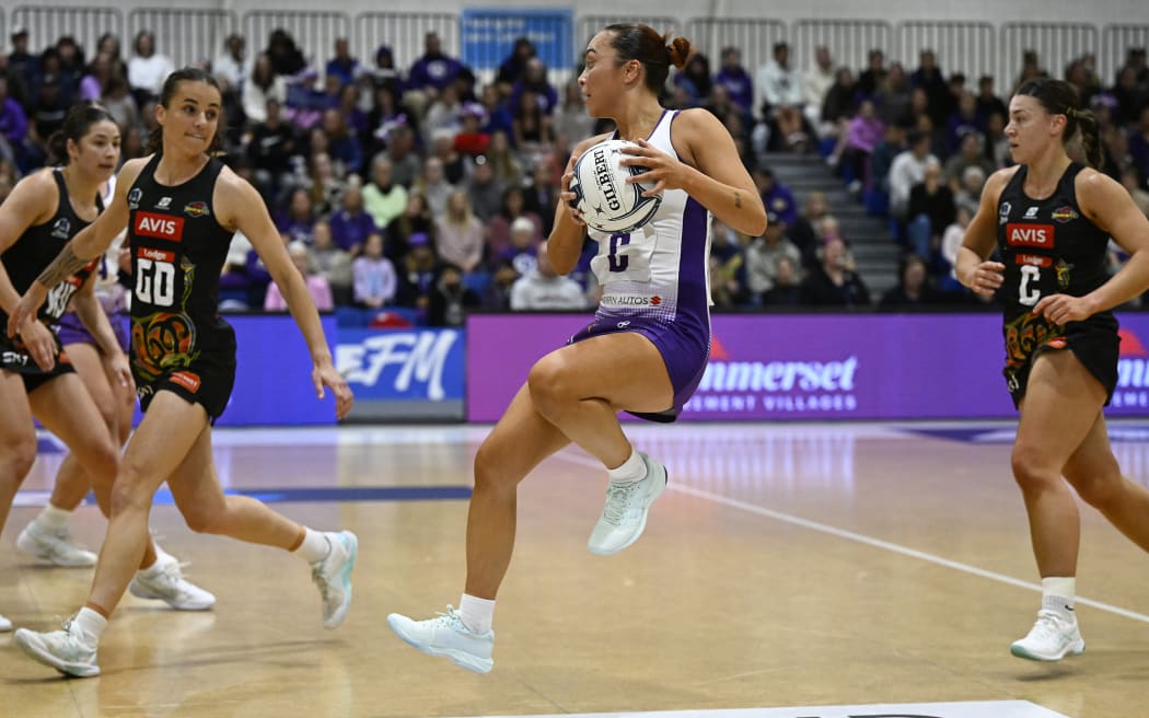 Mila Reuelu-Buchanan takes the ball in the Stars v Magic match at the Auckland Netball Centre on 3 June, 2024.