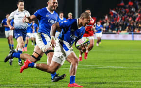 Ed Fidow scores one of Samoa's five tries against Tonga at Mount Smart Stadium.