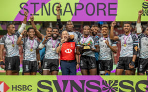 SINGAPORE - April 6: Fiji men celebrate their Cup victory at the 2025 HSBC SVNS Singapore at Singapore National Stadium on April 6, 2025 in Singapore. (Photo by Zach Franzen / World Rugby)