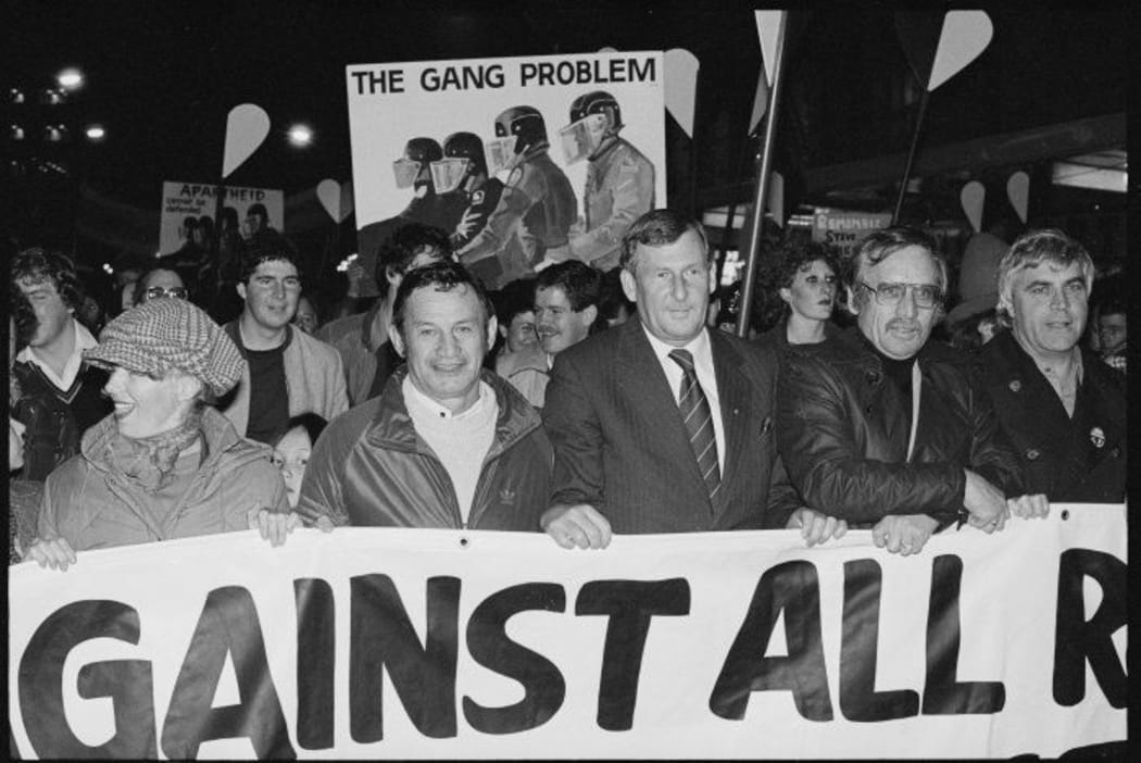 Race relations conciliator Hiwi Tauroa (2nd left) and Auckland mayor Colin Kaye (3rd left) leading an anti-apartheid march through Auckland, 11 Sep 1981.