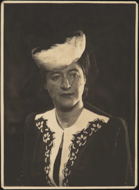 Flora McKenzie dressed for her court appearance on a charge of possessing prohibited goods (3400 American cigarettes) 1943. Elisabeth Easther suspects the cigarettes might have been payment for sex workers at Ring Terrace.