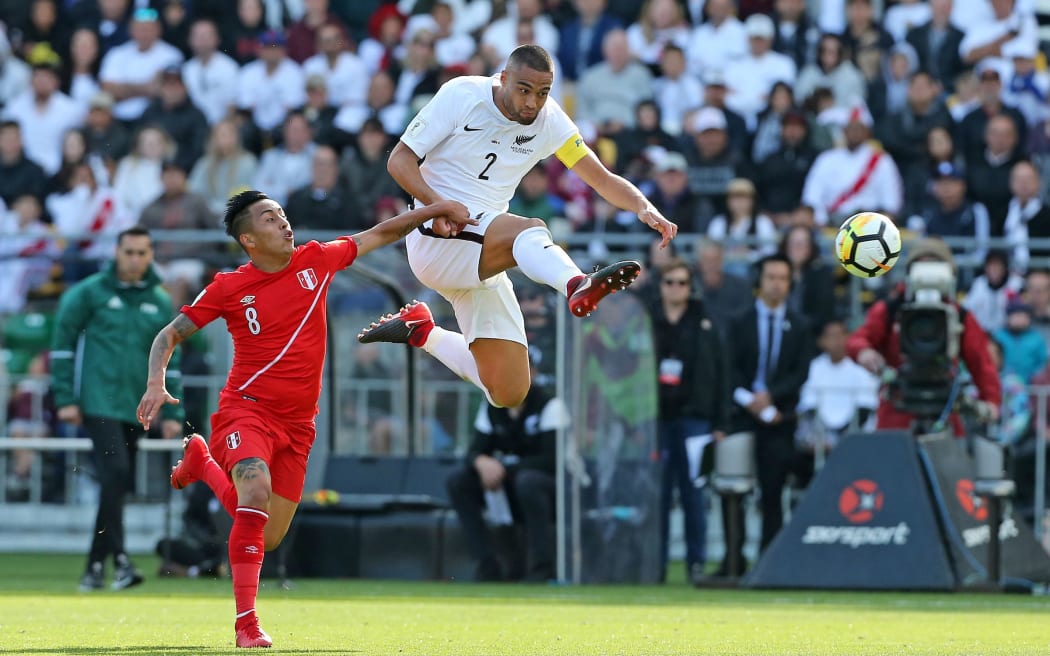 All Whites Winston Reid wins the ball ahead of Peru's Wilder Cartagena.